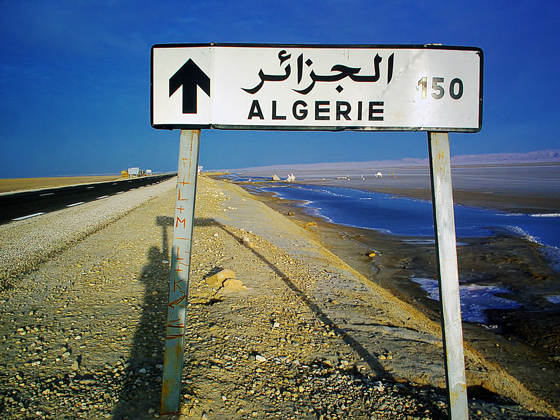 Road sign on a motorway showing distance to Algiers