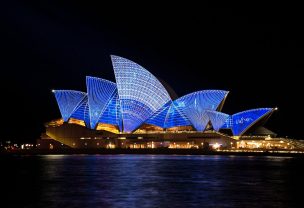 Sydney opera house lit up at night