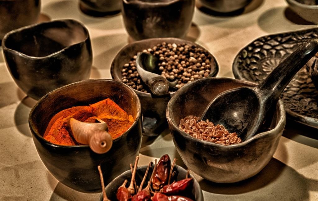 Various spices inside ceramic bowls