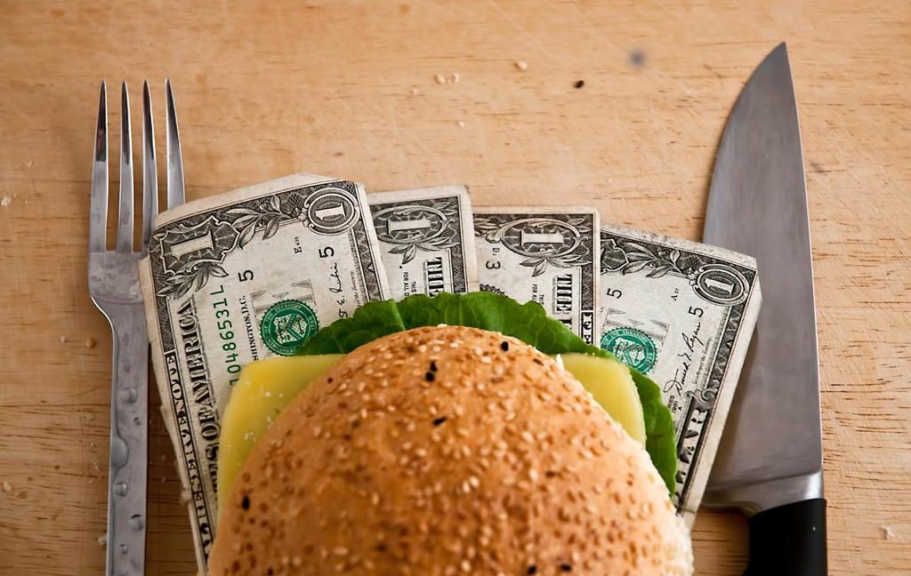 US dollars in a hamburger bun, close-up